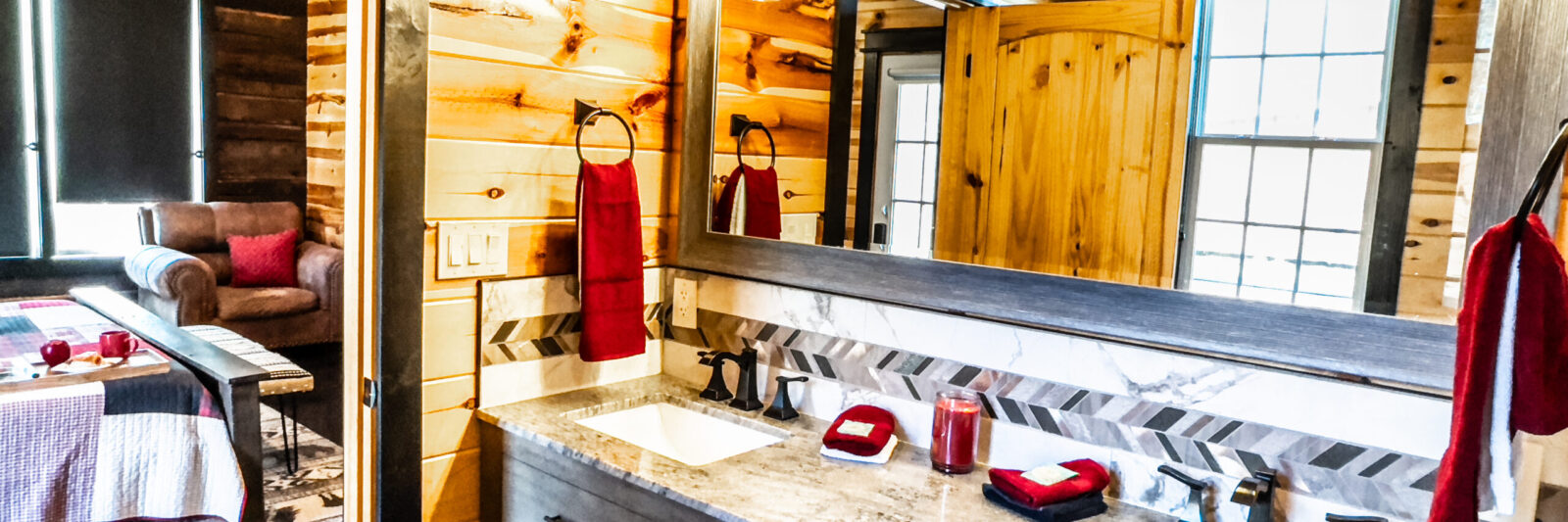 Bright rustic bathroom with wooden walls and modern fixtures.