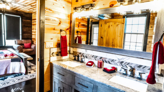 Bright rustic bathroom with wooden walls and modern fixtures.